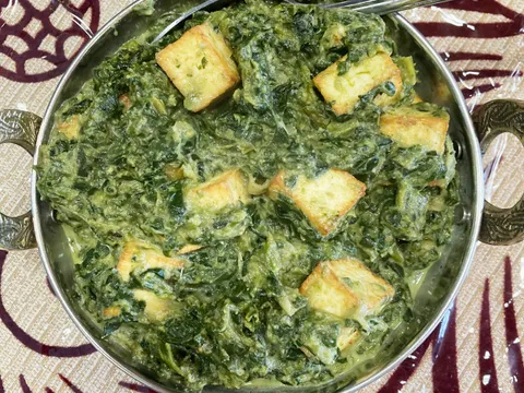 Palak paneer served in a copper karahi at India Kutir