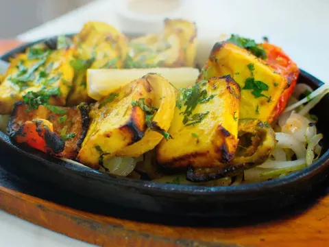 Sizzling spiced paneer with peppers and onions